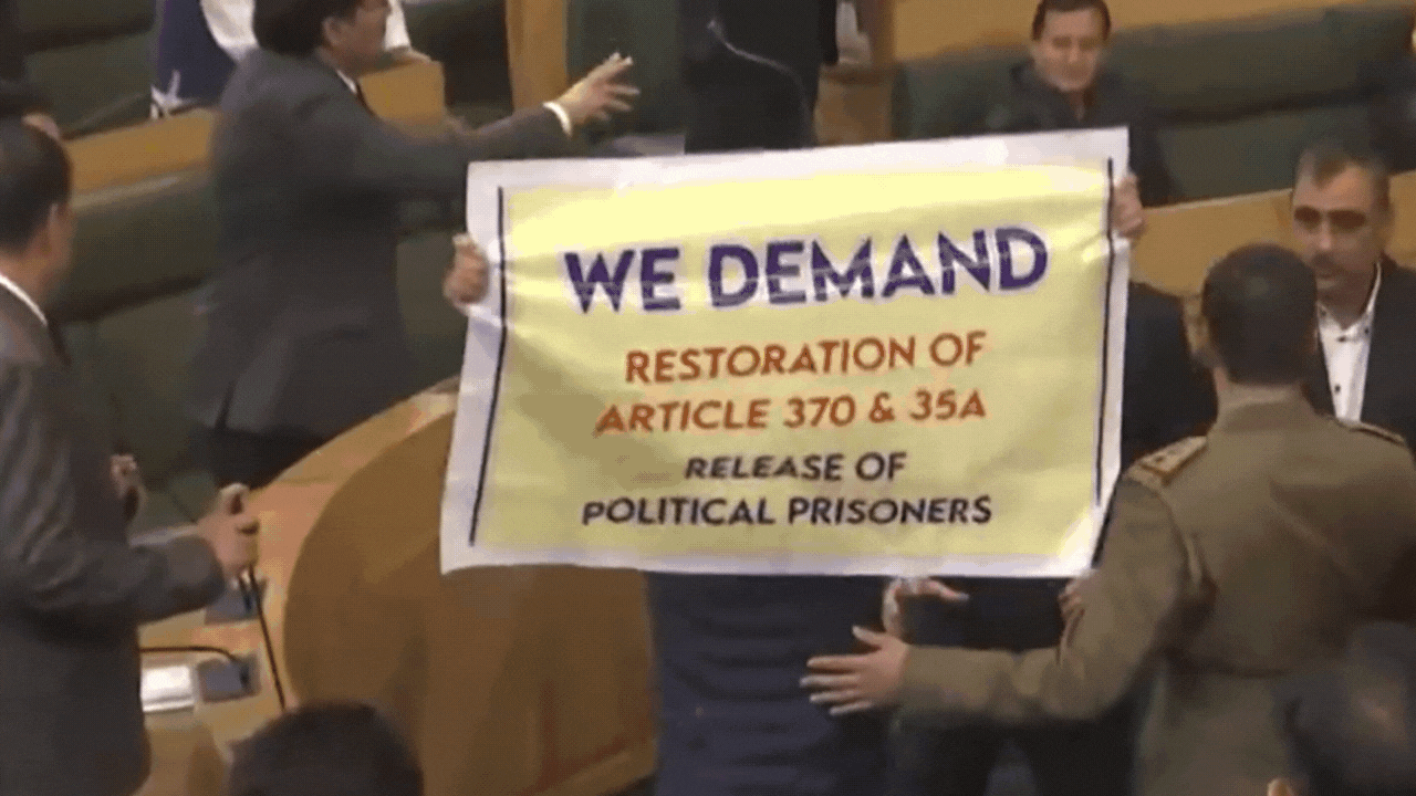 Watch: Massive ruckus in J&K assembly as MLAs clash over Article 370 banner