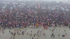 Millions perform bathing ritual on day two of India’s Mahakumbh Mela