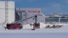 Three critically injured after plane flips at Toronto airport