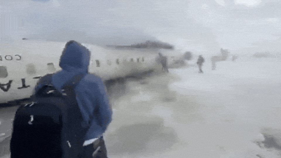 Video: Delta plane flipped upside down on snowy runway on Toronto airport