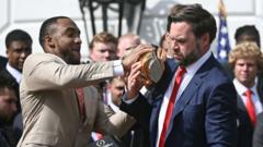Watch: JD Vance drops college football trophy at White House ceremony