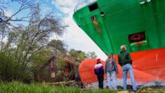 Man in Norway wakes to find huge container ship in garden