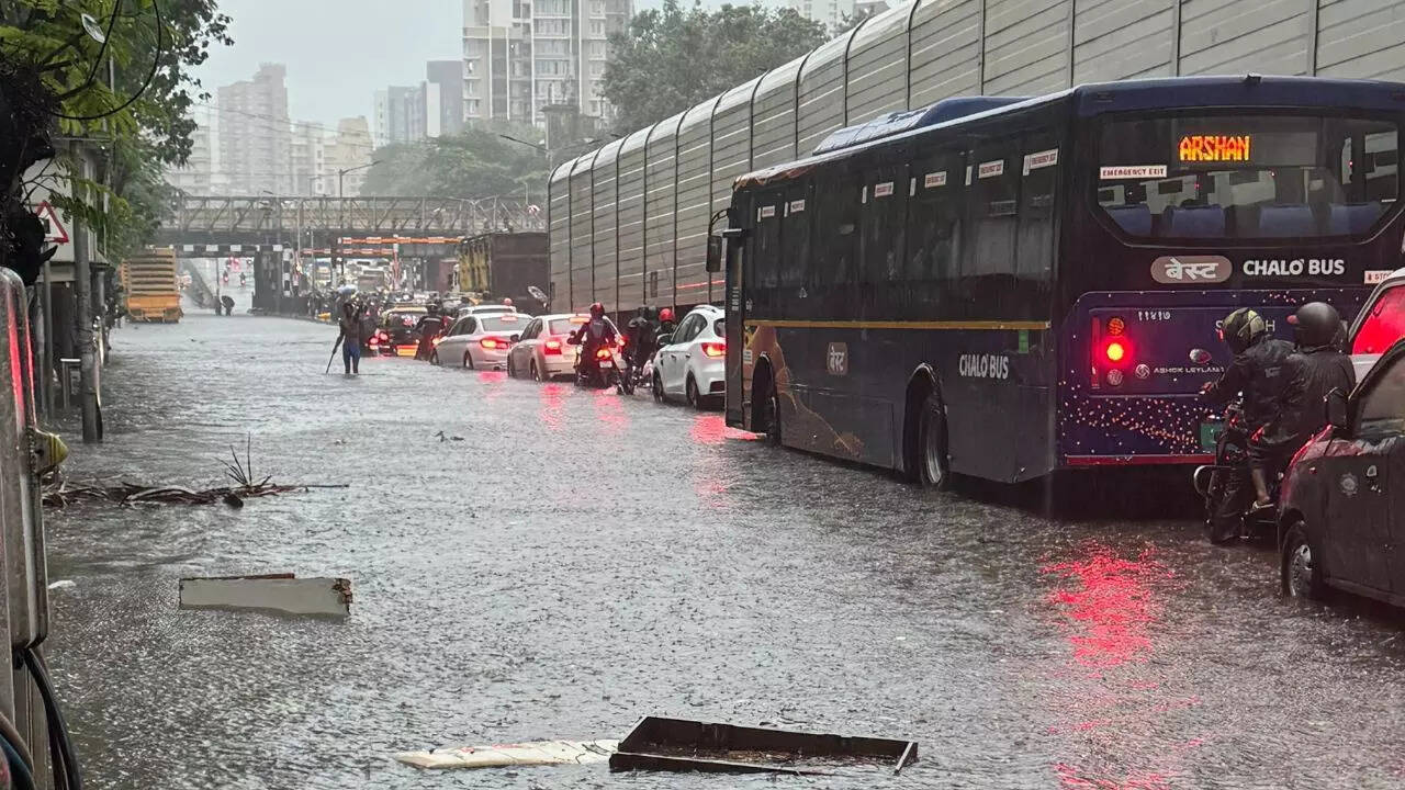 Trains crawl, roads waterlogged, buses diverted as Mumbai reels under heavy rain