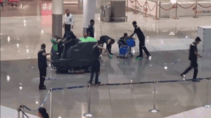 Watch: Rainwater enters Delhi airport terminal; staff use buckets to clear it