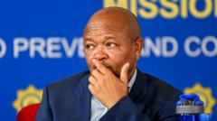 South Africa’s police minister accused of links to criminal gangs