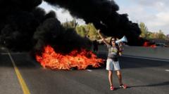 Palestinians flee IDF attacks on Gaza City as Israelis protest against occupation plan