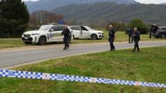 Manhunt under way after two police officers shot dead in rural Australian town