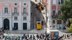 Boy, 3, pulled from funicular crash that has shocked Portugal