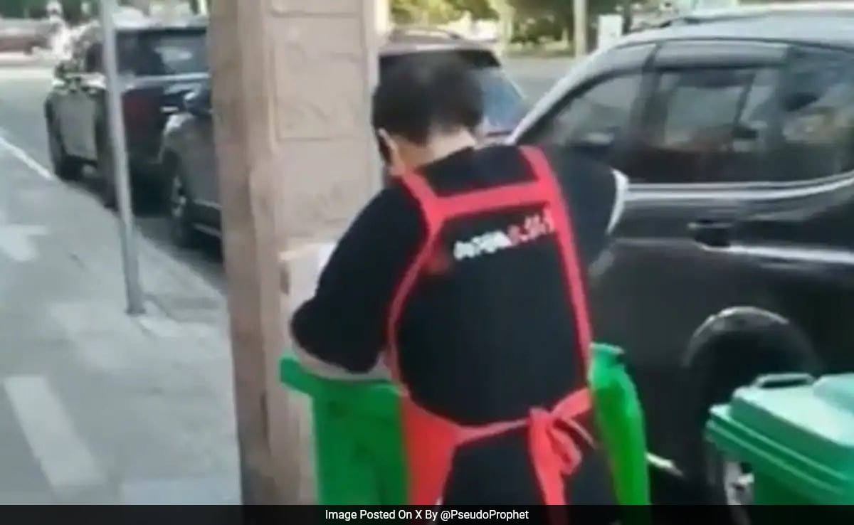 Chinese Restaurant Faces Backlash After Employee Caught Scooping Oil From Street Bin