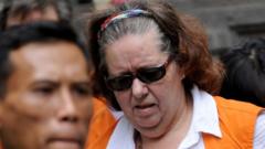 British grandmother flies home after 12 years on Indonesian death row
