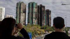 Hong Kong to vote in election as city mourns deadly fire